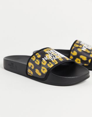 The North Face Base Camp III printed sliders in yellow leopard print