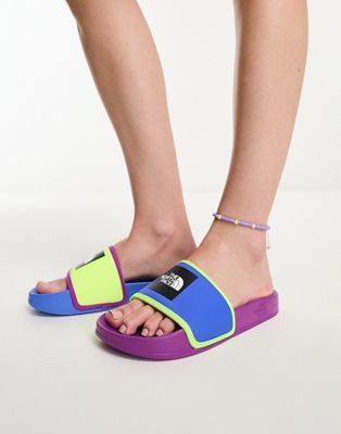 The North Face Base Camp III slides in purple, blue and yellow