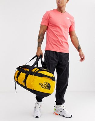 the north face yellow duffel bag