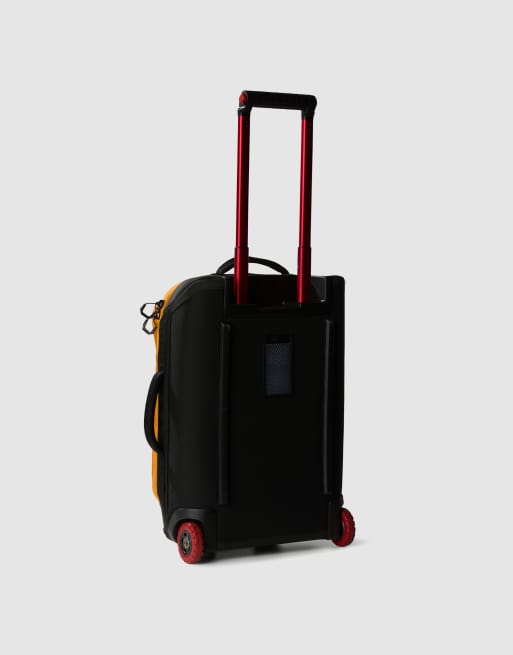 The North Face Base camp rolling thunder 22 suitcase in yellow and black ASOS