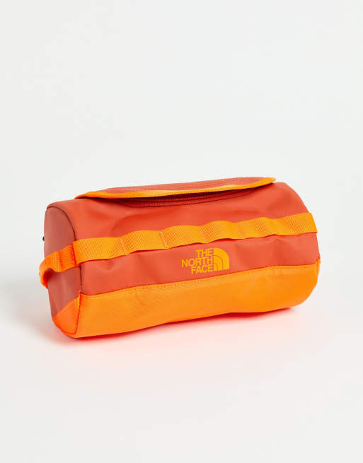 The North Face Base Camp S Travel canister in orange ASOS