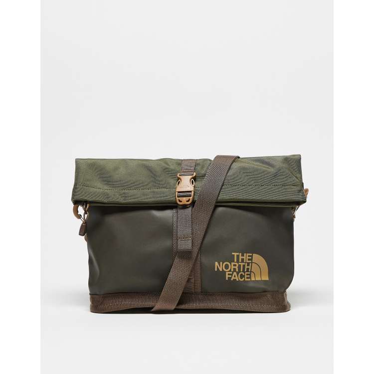 The North Face Base Camp shoulder bag in green with brown