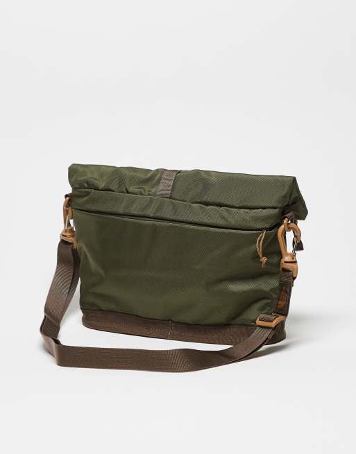 The North Face Base Camp shoulder bag in green with brown