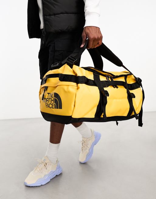 The North Face Base Camp small 50L duffle bag in yellow and black