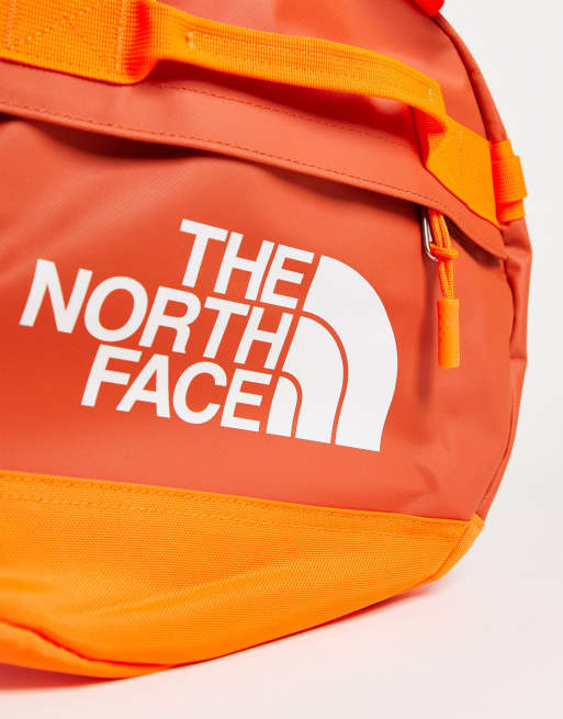 North face hotsell orange duffel bag