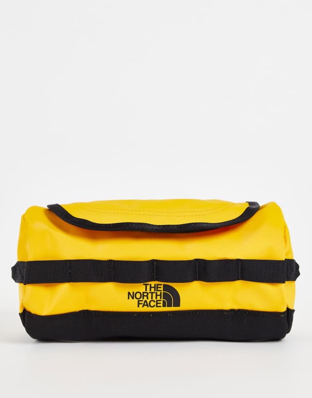 The North Face Base Camp small travel canister in yellow and black