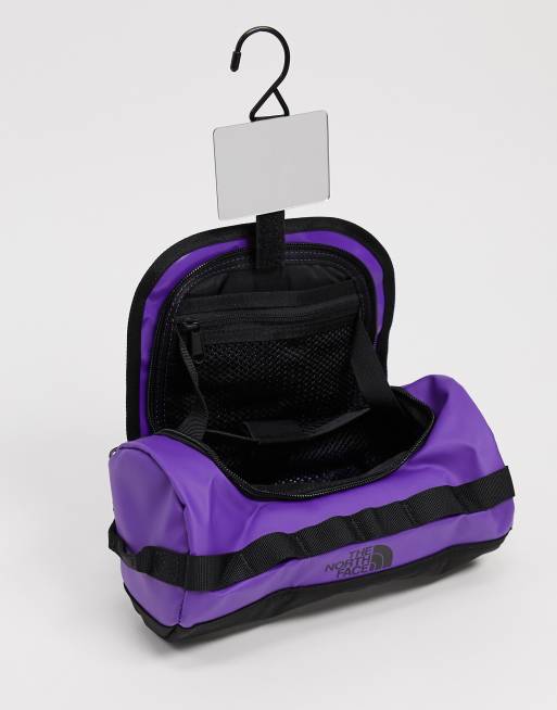 The North Face Base Camp small travel canister wash bag in purple