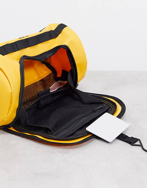 Cater koolstof Manier The North Face Base Camp travel canister large toiletry bag in yellow | ASOS