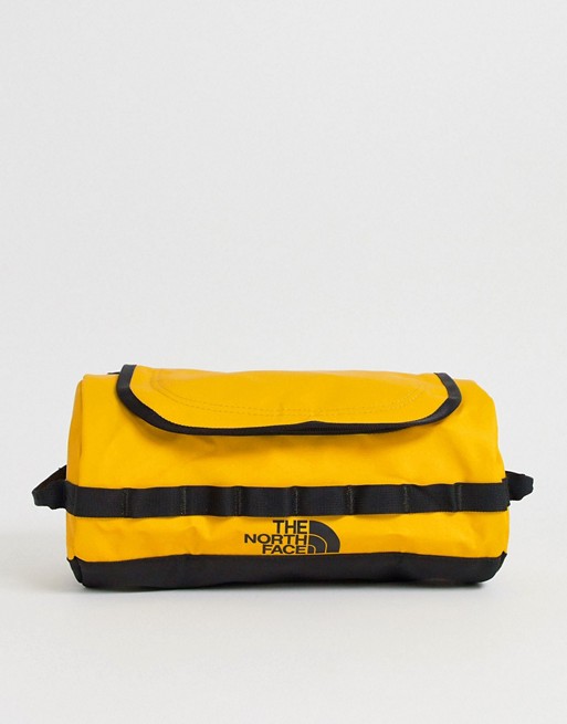 The North Face Base Camp Travel Canister large wash bag in yellow