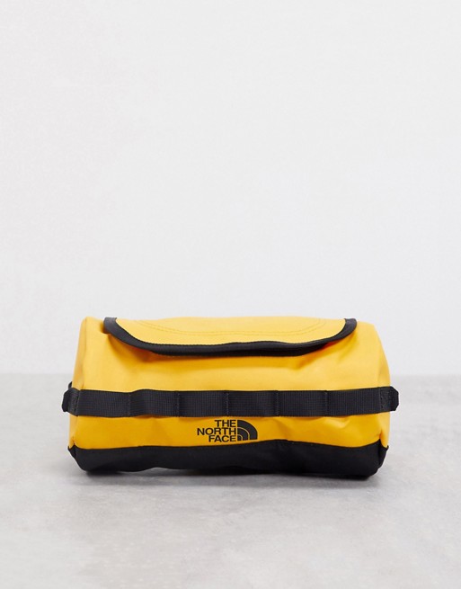 The North Face Base Camp travel canister small wash bag in yellow