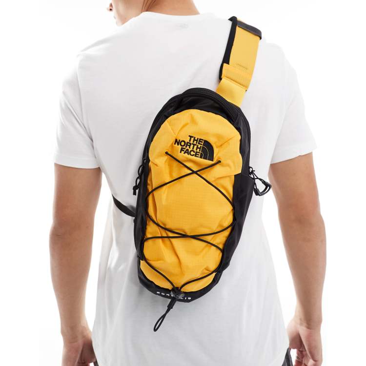 The North Face Borealis sling in summit gold tnf black ASOS