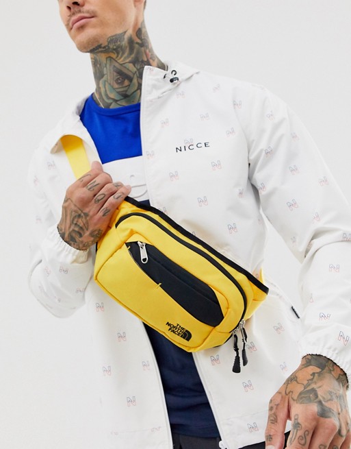 The North Face Bozer bum bag in yellow