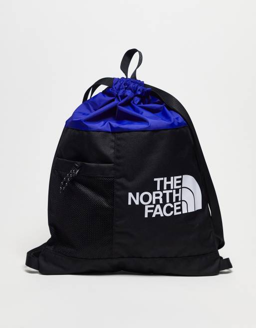 The North Face Bozer cinch bag in blue and black | ASOS