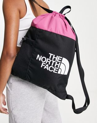 The North Face Bozer cinch bag in pink and black