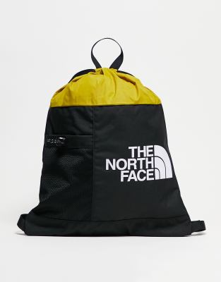 The North Face Bozer Cinch pack in yellow and black | ASOS