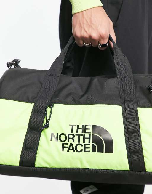 The North Face Bozer duffel bag in yellow and black, 2 of 4