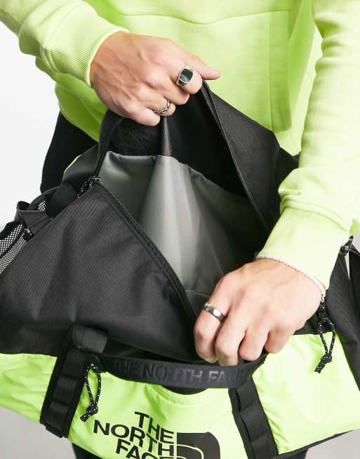 The North Face Bozer duffel bag in yellow and black, 4 of 4