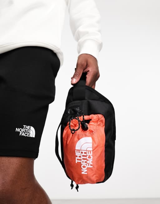 The North Face Bozer III bum bag in orange and black, 2 of 4
