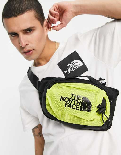 The North Face Bozer III bum bag in yellow | ASOS