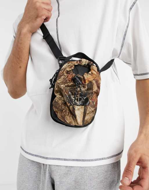 The North Face Bozer III cross body bag in camo ASOS