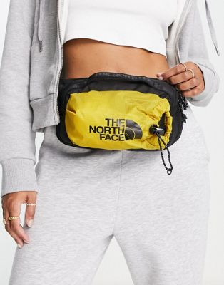 The North Face Bozer III L bum bag in yellow and black