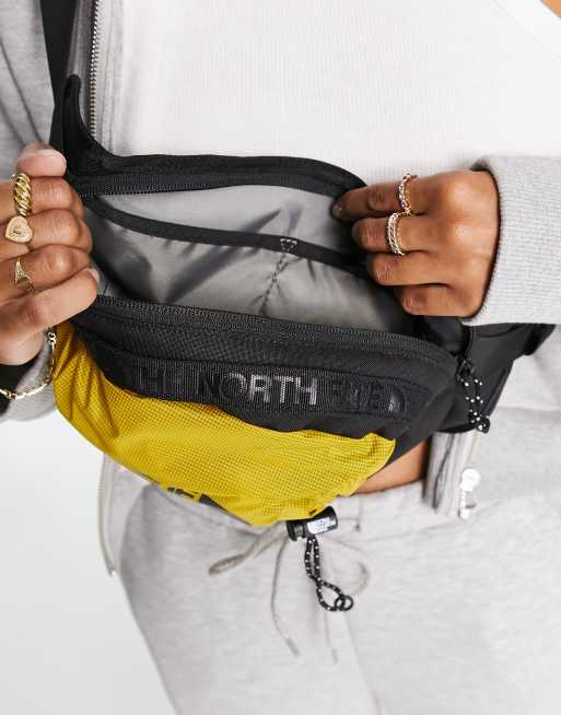 The North Face Bozer III L bum bag in yellow and black, 3 of 4