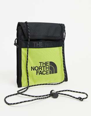 The North Face Bozer III neck pouch in yellow - ASOS Price Checker