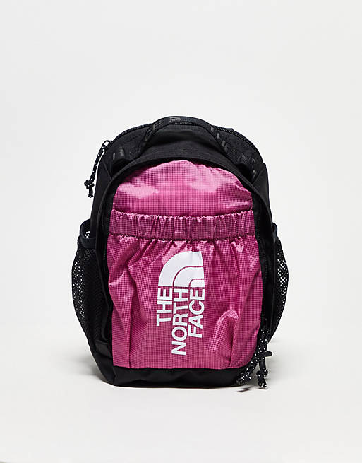 The North Face Bozer mini backpack in pink and black | ASOS