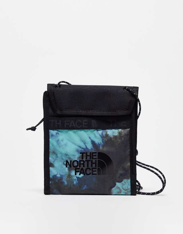 The North Face Bozer neck pouch in black and wasabi green tie dye