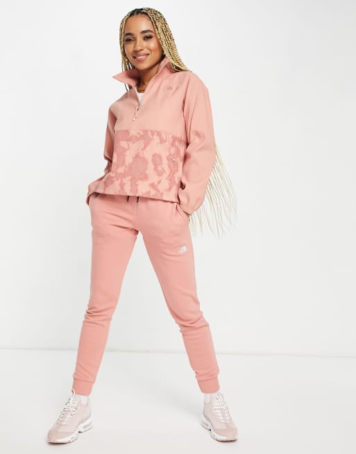 Pink north face on sale tracksuit