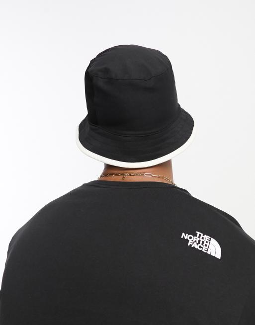 The North Face Class V Reversible bucket hat in black and white