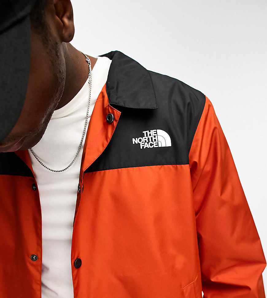 The North Face Coach jacket in orange and black Exclusive at ASOS