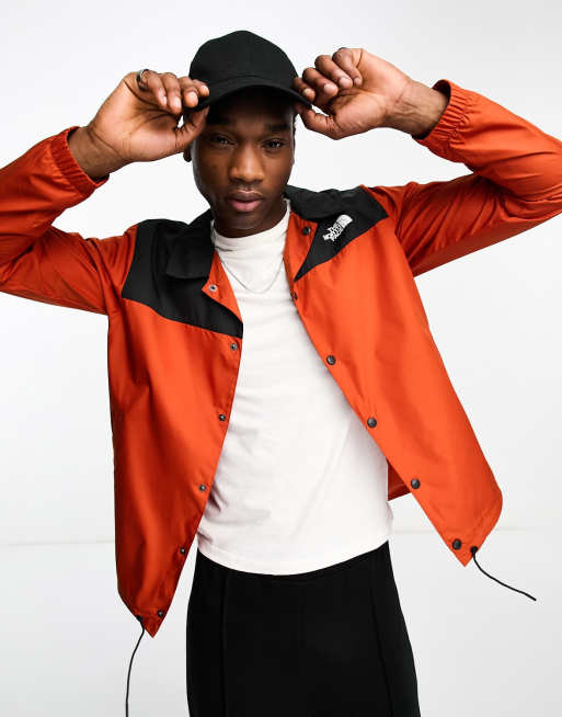 The north face orange and black on sale jacket