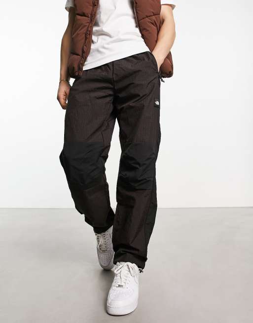 The North Face Convin ripstop trackies in red and black