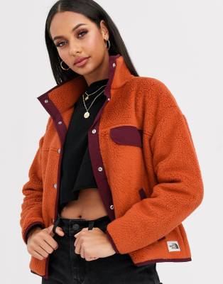 orange north face fleece jacket