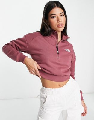 The North Face cropped 1/4 zip sweat with ribbed hem in pink Exclusive at ASOS