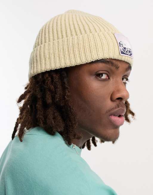 The North Face Cuffed graphic beanie in beige | ASOS