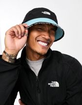 The North Face Class V Reversible bucket hat in black and white