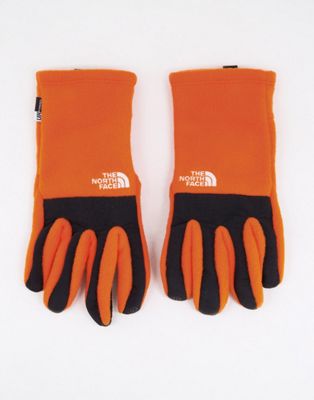 The North Face Denali Etip gloves in orange