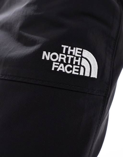 The North Face Easy Wind track pants in black | ASOS