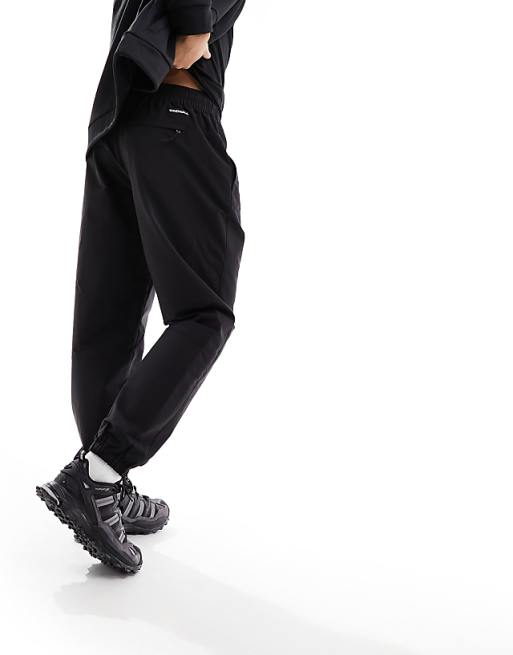 The North Face Easy Wind track pants in black | ASOS The North Face Easy Wind track pants in black | ASOS