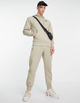 beige north face tracksuit