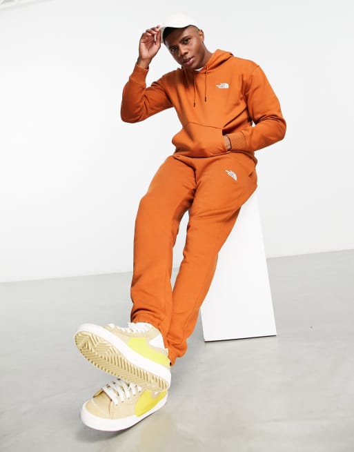 The North Face Essential hoodie in orange Exclusive at ASOS ASOS