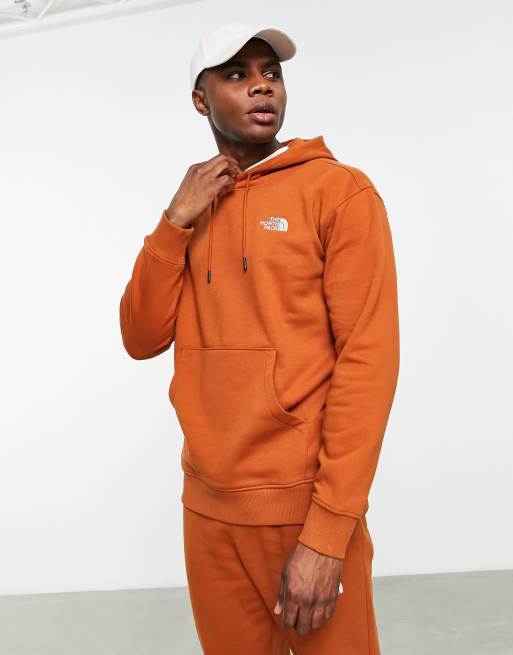 The North Face Essential hoodie in orange Exclusive at ASOS