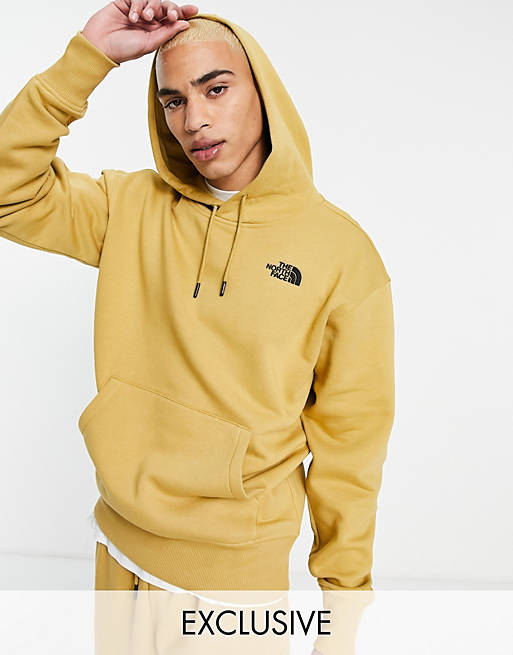 The North Face Essential hoodie in yellow Exclusive at ASOS | ASOS