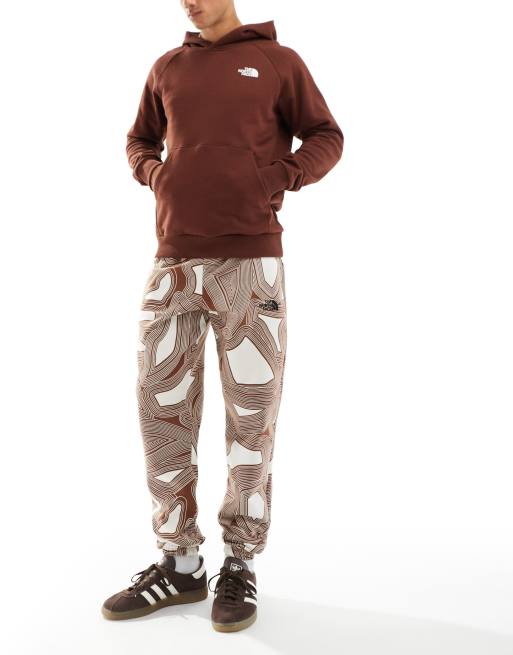 The North Face Essential oversized fleece joggers in brown geo print  Exclusive at ASOS