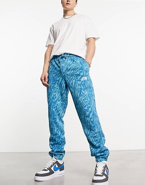 The North Face Essential oversized joggers in blue marble print Exclusive at ASOS