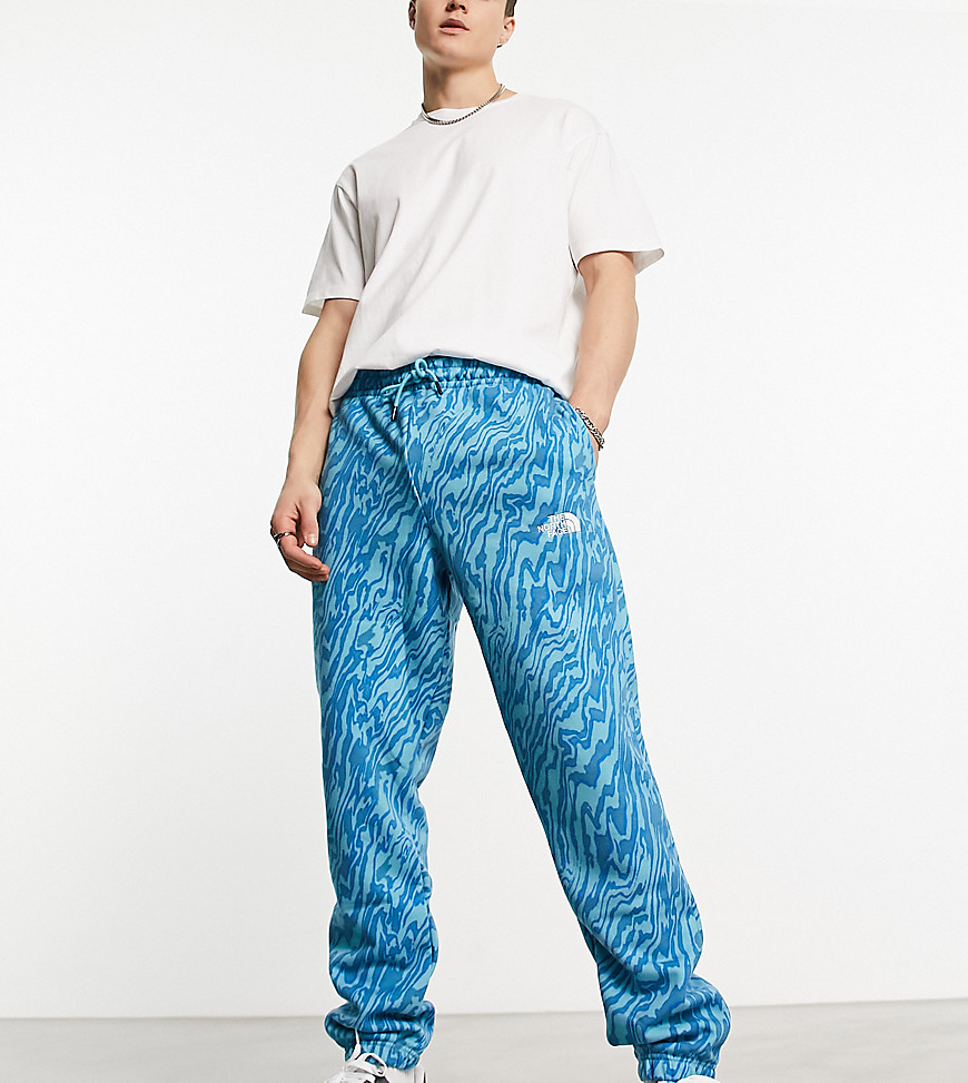 The North Face Essential oversized joggers in blue marble print Exclusive at ASOS