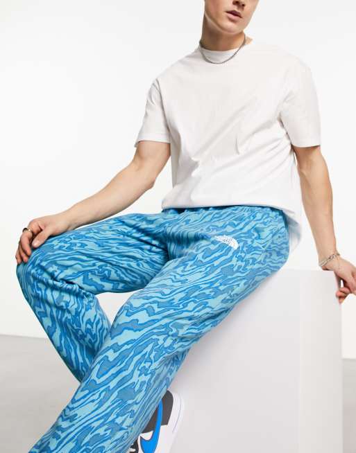 The North Face Essential oversized joggers in blue marble print Exclusive  at ASOS