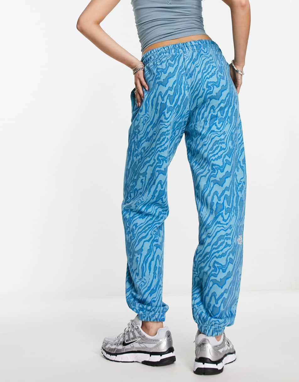 The North Face Essential oversized joggers in blue marble print